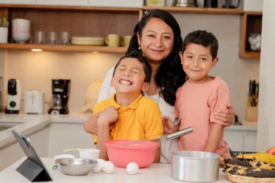 Portrait of mother and children cooking at home - single mother with two children - children helping in the kitchen - mother's day
2461503089